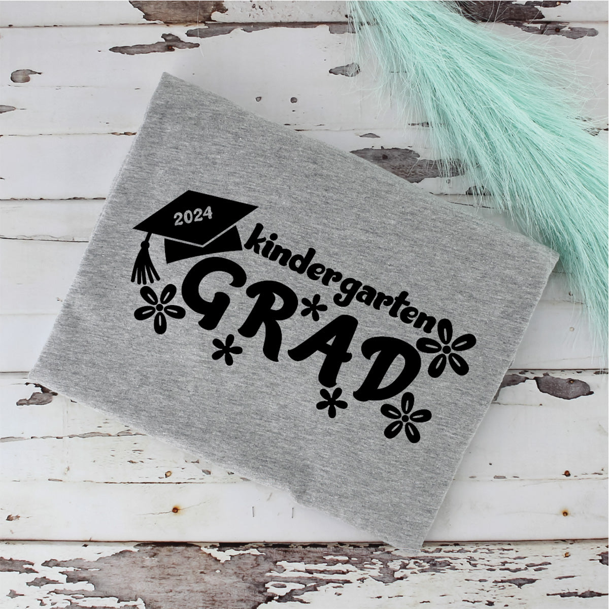 Kindergarten Grad Graphic with Cap, Year, and Flowers