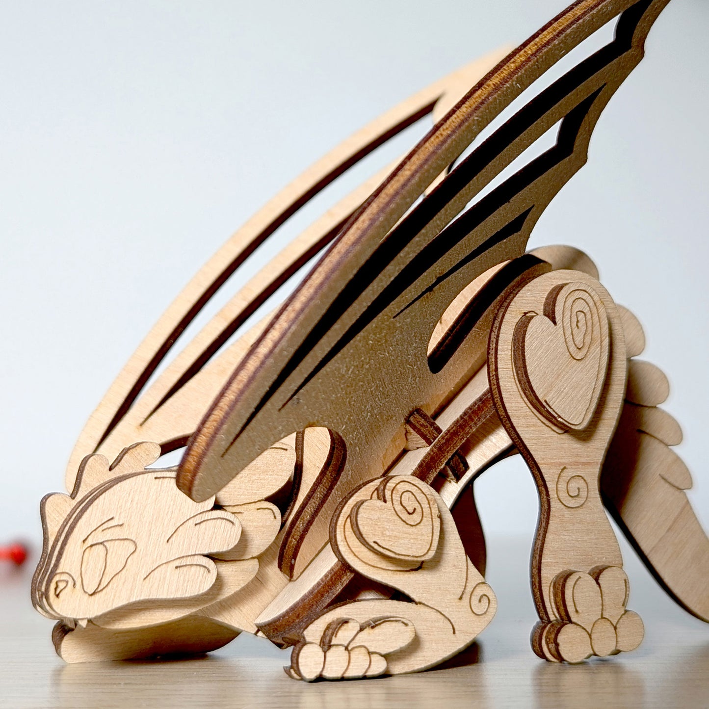 Playful Dragon Ornament with Wings and Hearts - Glowforge