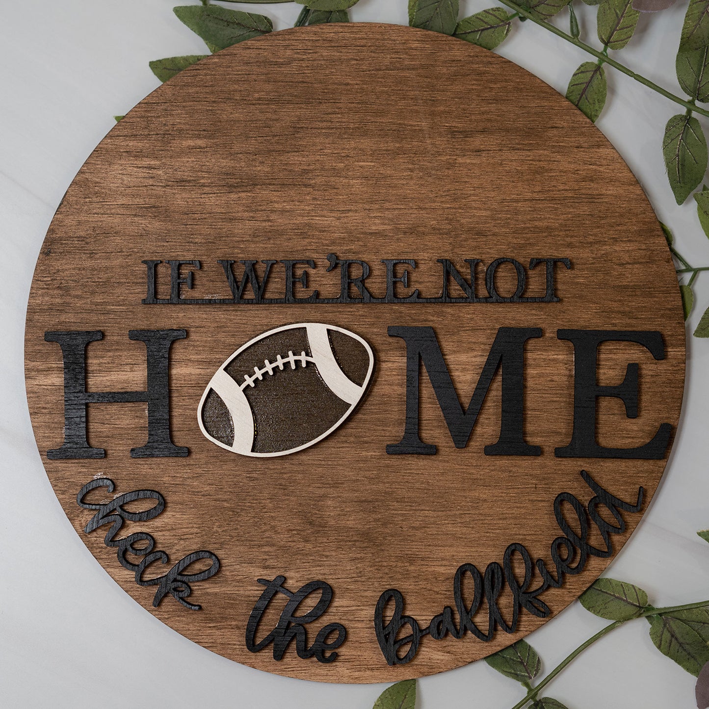 If We're Not Home Check The Ballfield - Football Round Sign