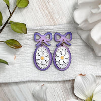 Whimsical Daisy Dangle Earrings with Bow Accent