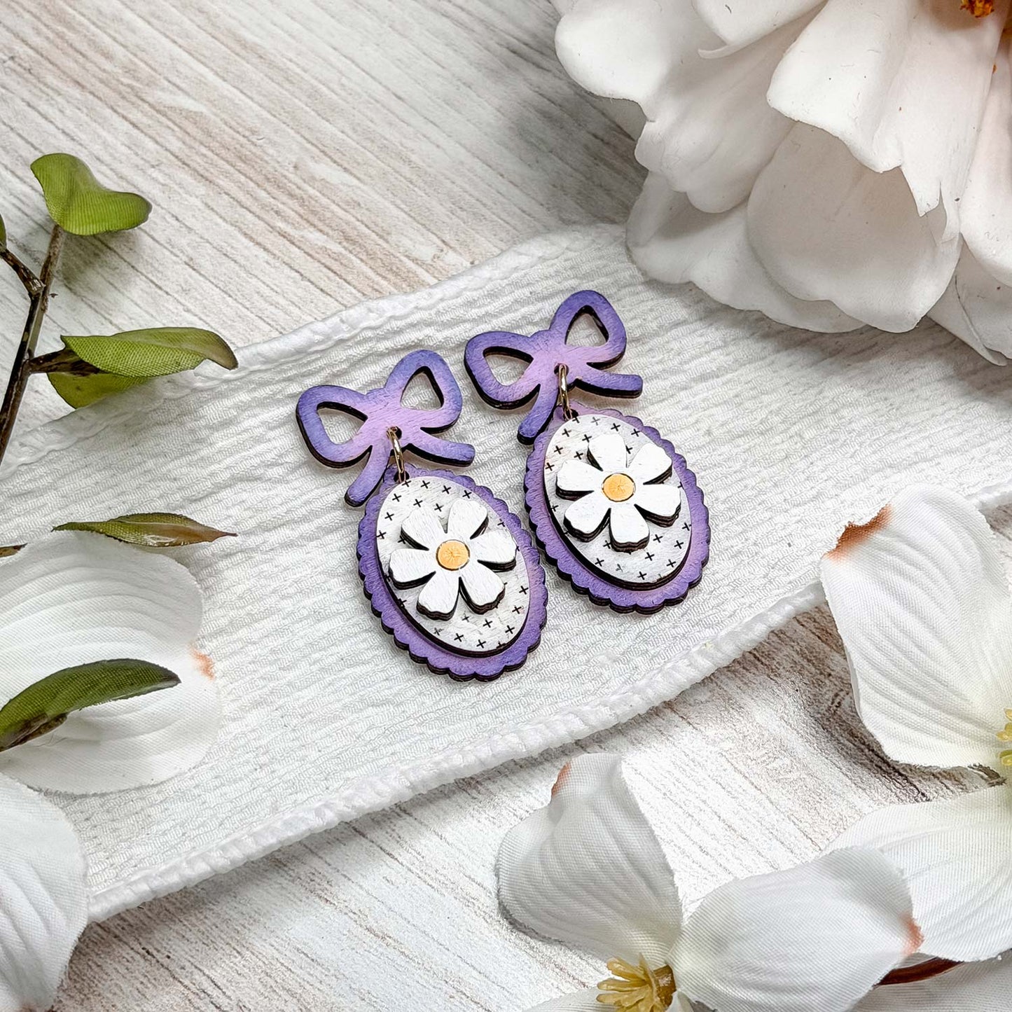Whimsical Daisy Dangle Earrings with Bow Accent