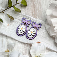 Whimsical Daisy Dangle Earrings with Bow Accent