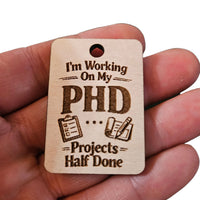 "Working On My PHD...Projects Half Done" Keychain - Glowforge